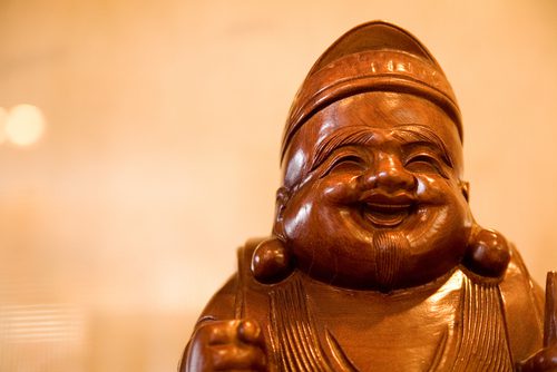 different types of laughing buddha statues