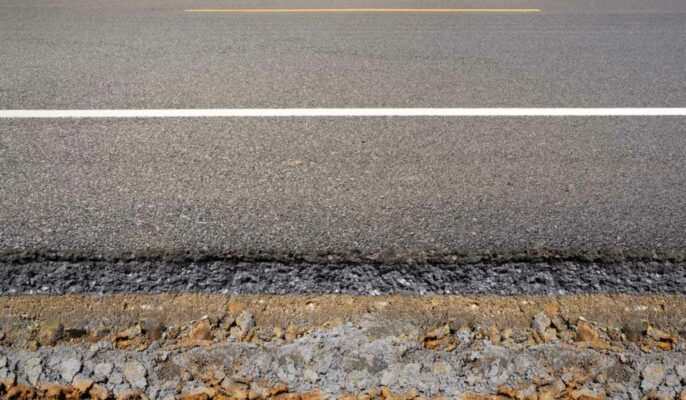 What is road cross-section, and what are its elements?