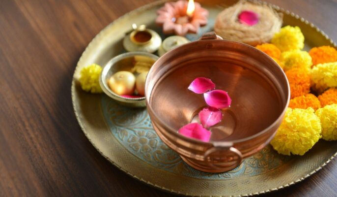 Why do we keep water in pooja room?